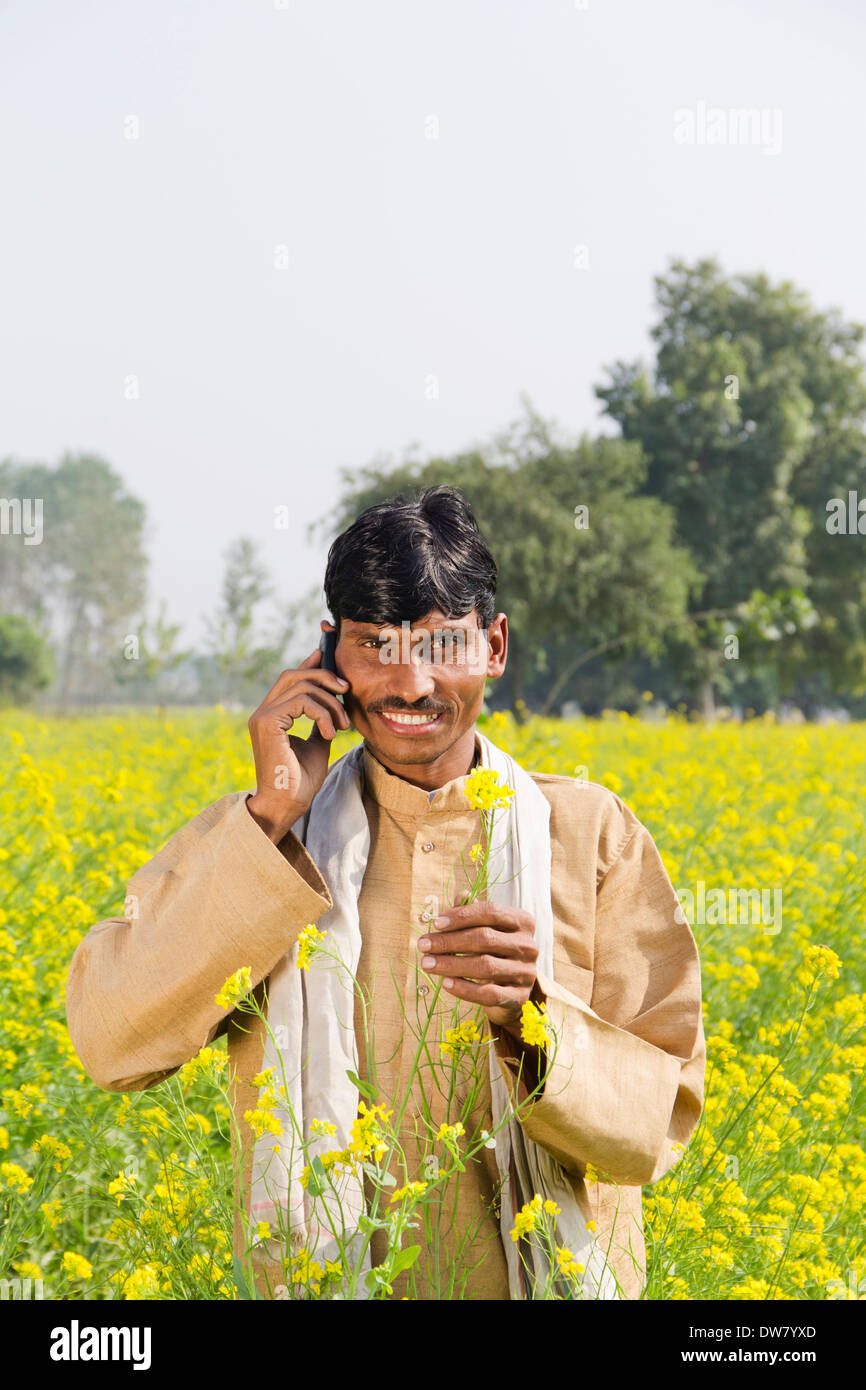 1 Indian farmer standing in farms and talking Stock Photo - Alamy