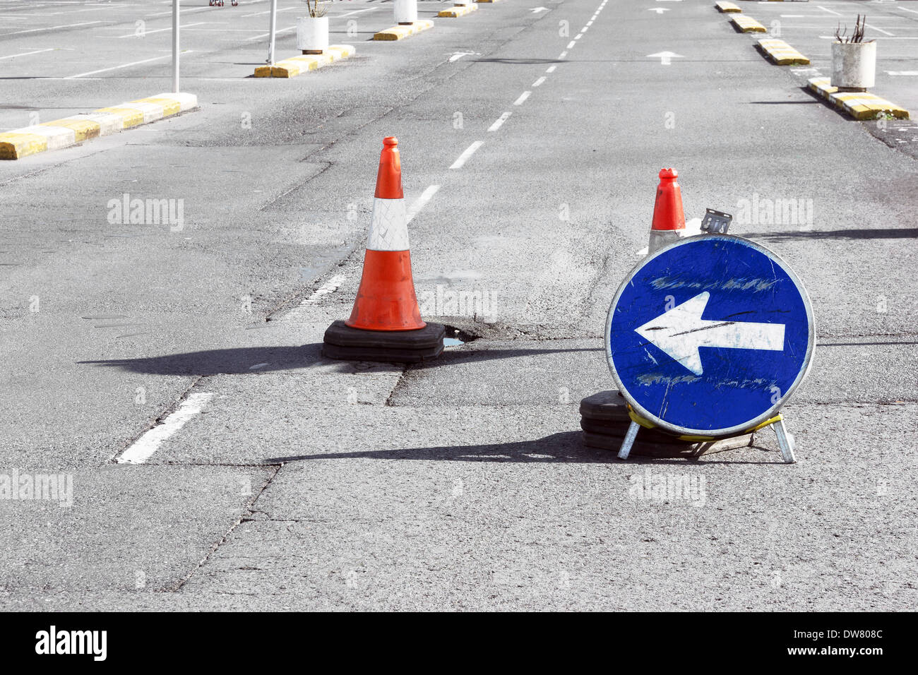 Road detour sign and cones due a pothole Stock Photo