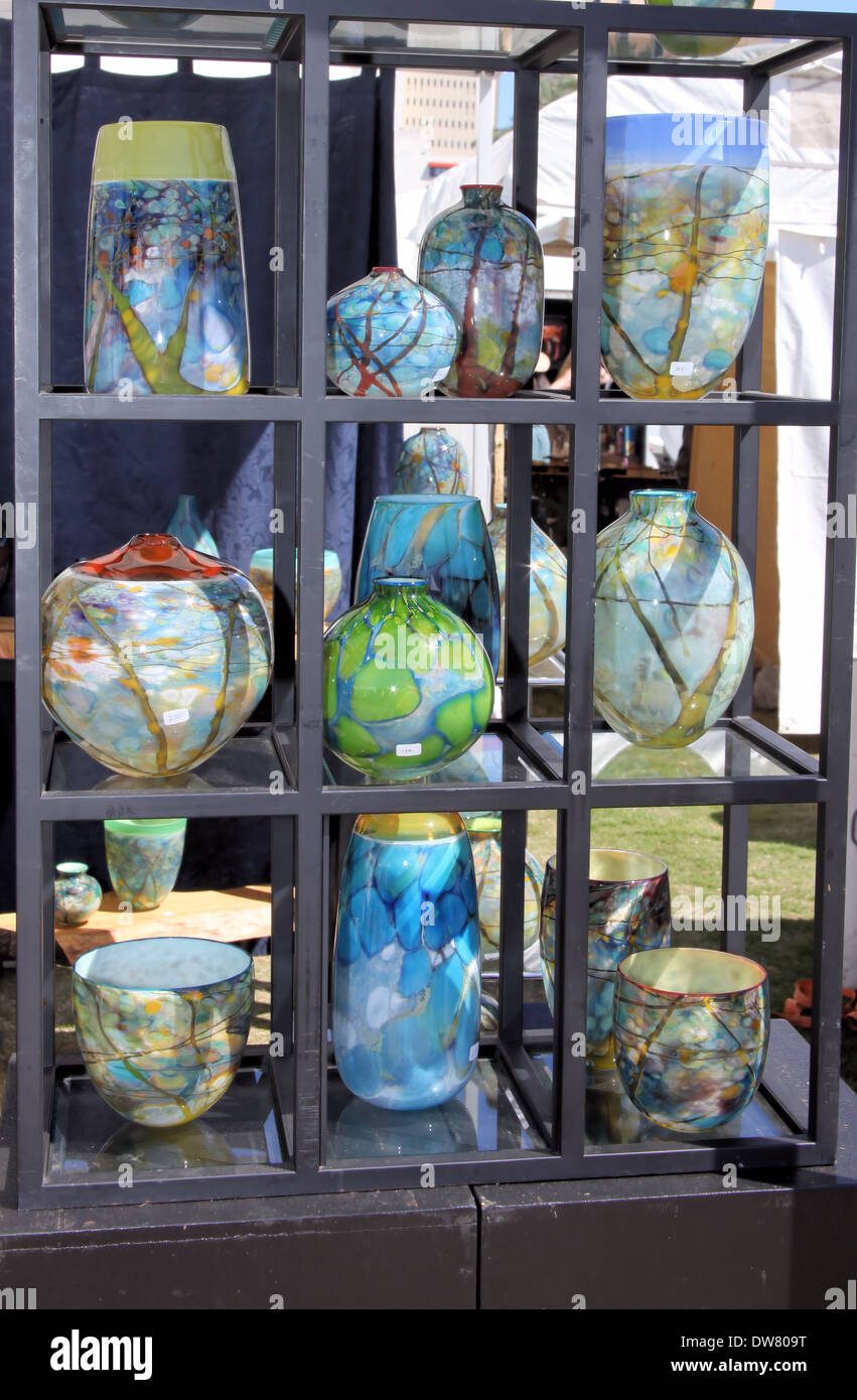 VASES ON SHELF,COLORFUL AND MANY SHAPES Stock Photo