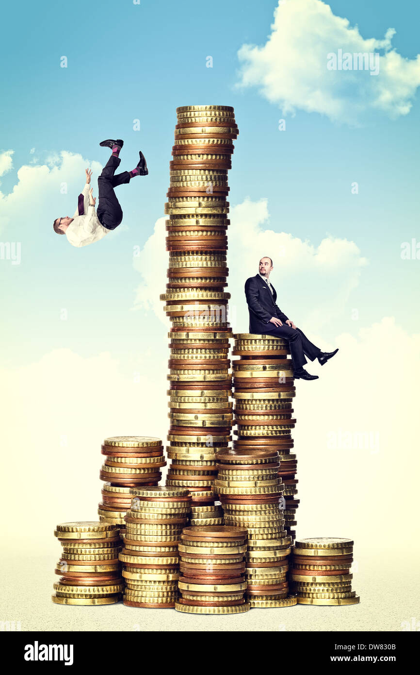 man fall from money tower Stock Photo