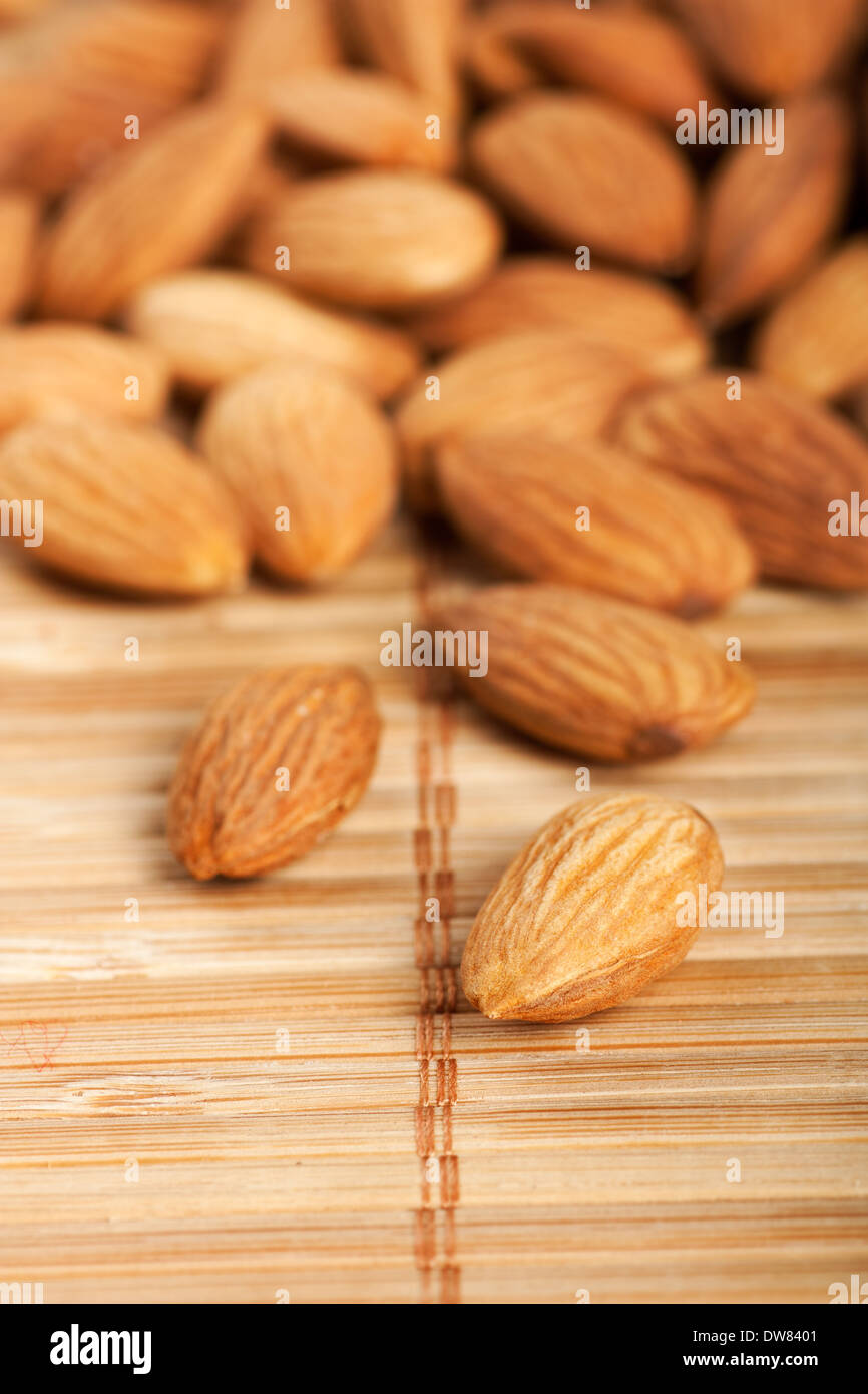 healthy-food-organic-nutrition-pile-of-raw-almonds-on-bamboo-background