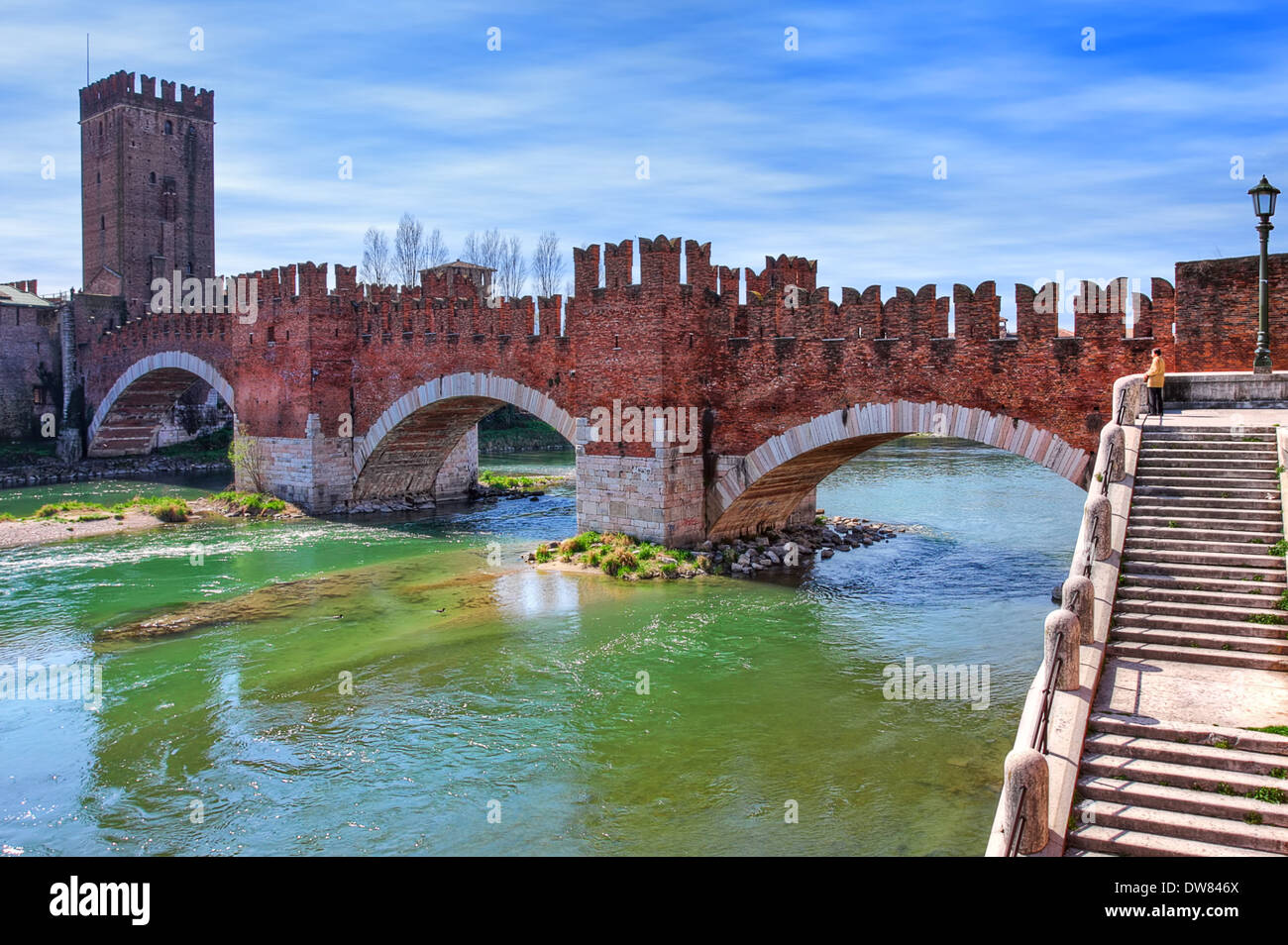 Famous red brick Castelvecchio bridge across Adige river in Verona ...