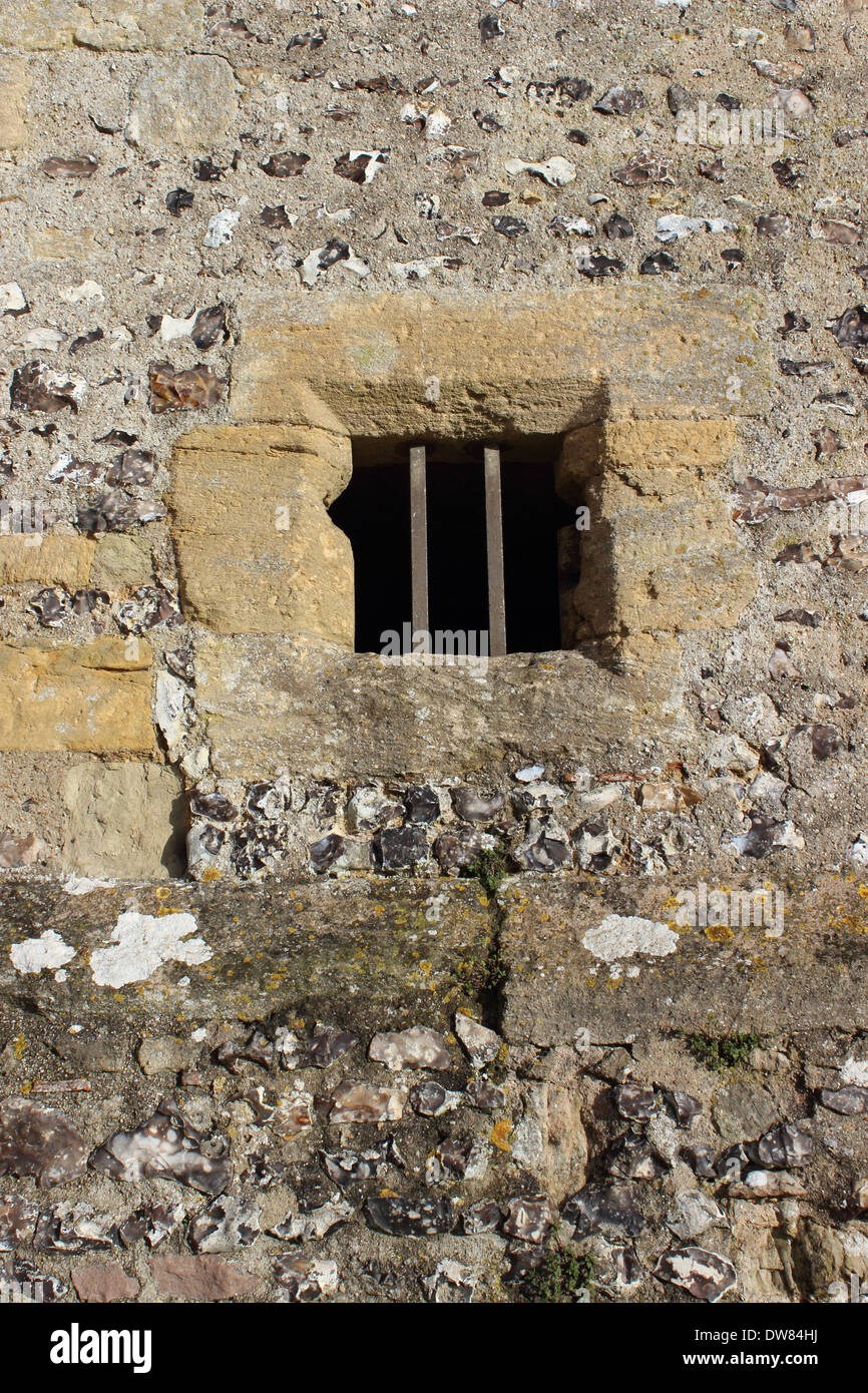 Small barred jail-type window in tower of Donnington Castle, Berkshire. Stock Photo