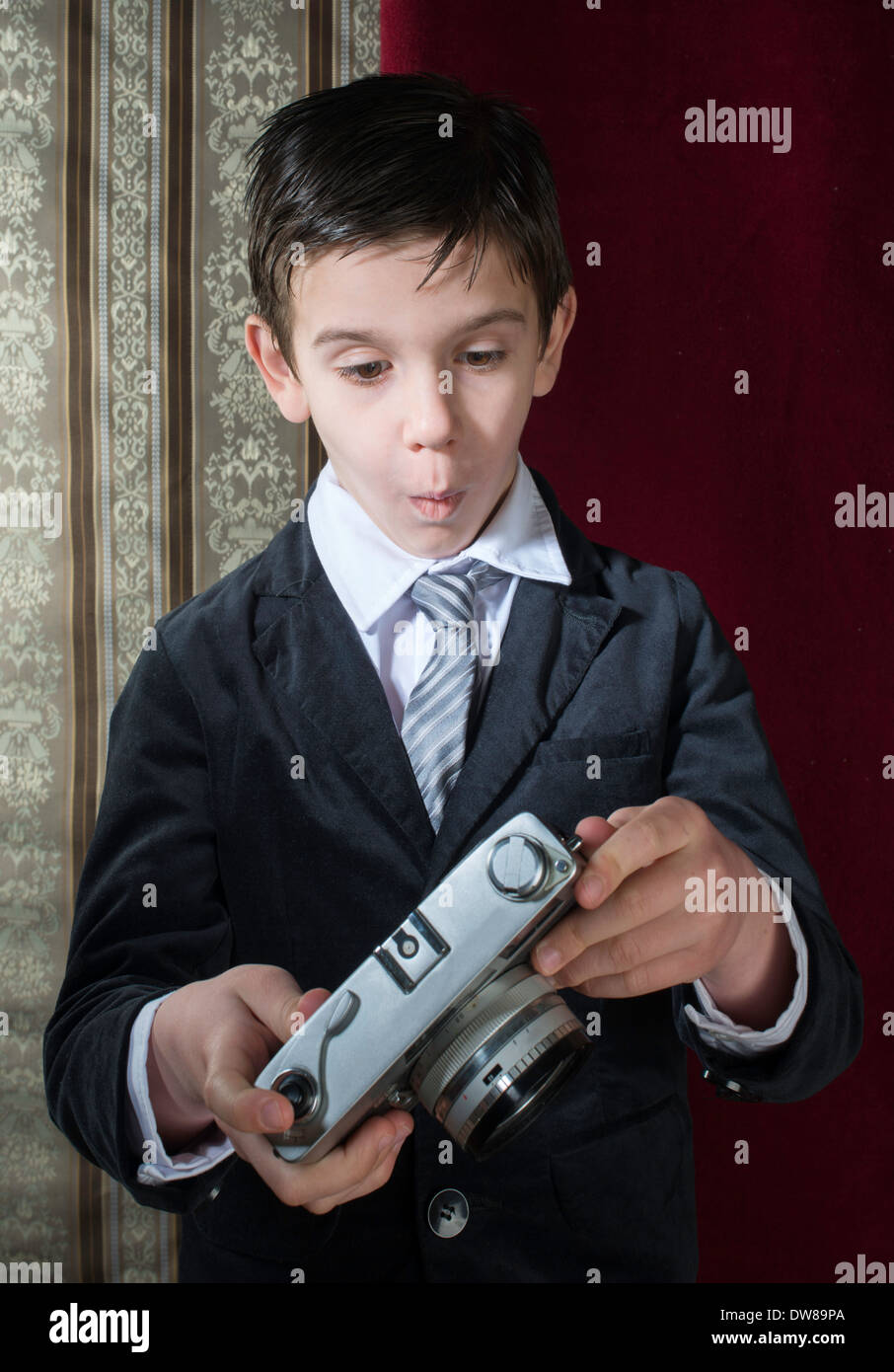 Boy with vintage camera. Vintage clothes Stock Photo Alamy