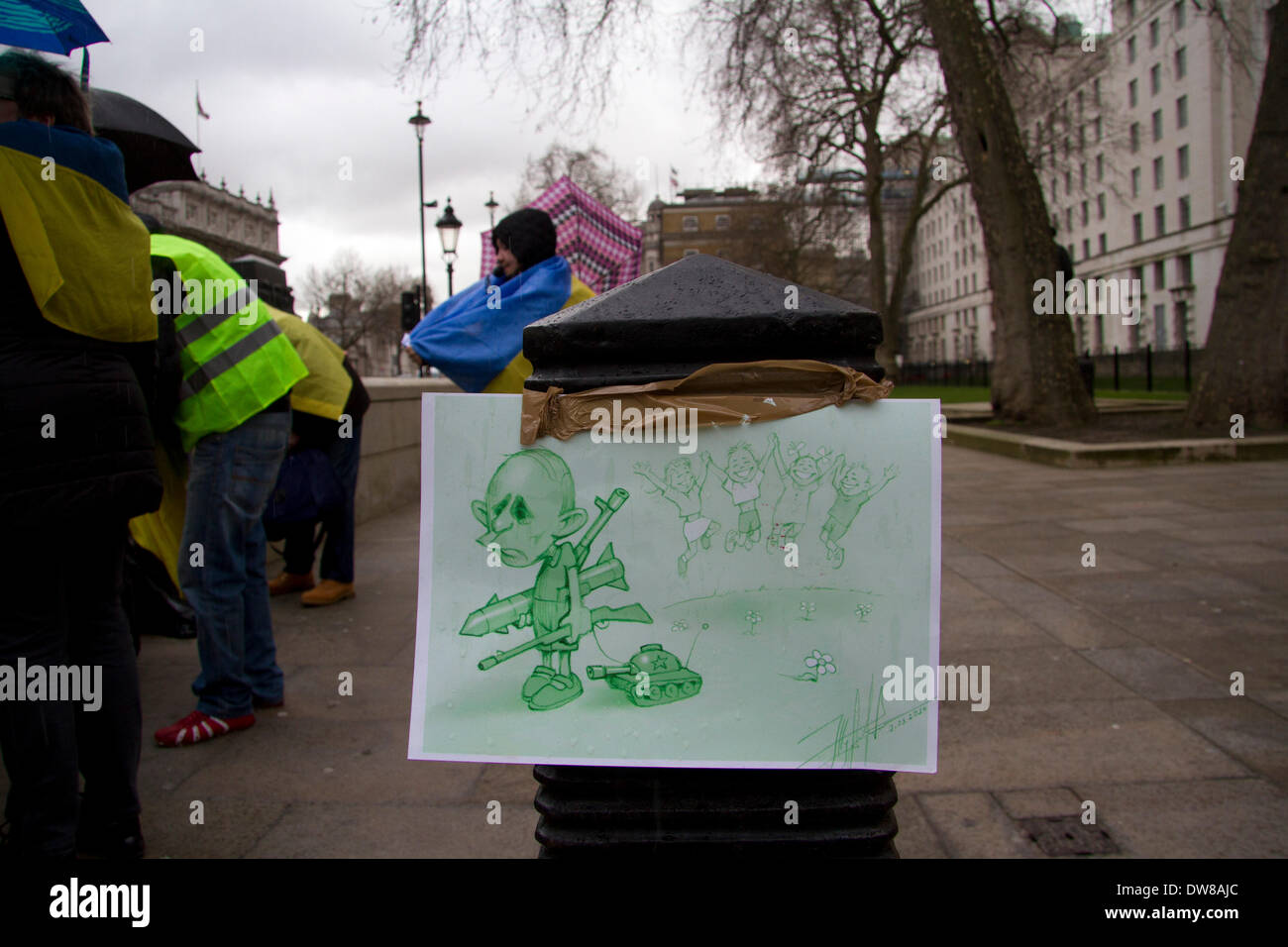 Westminster London,UK 3rd March 2014. The Russian president Vladimir Putin is caricatured as a military aggressor by Ukrainian protesters outside Downing Street  following the Russian military intervention in Crimea Stock Photo