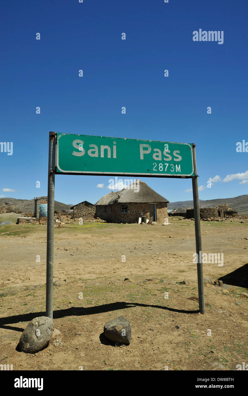 Sani Pass, Kingdom of Lesotho, sign, top of Maluti mountains at border with South Africa, landscape, house, blue sky Stock Photo