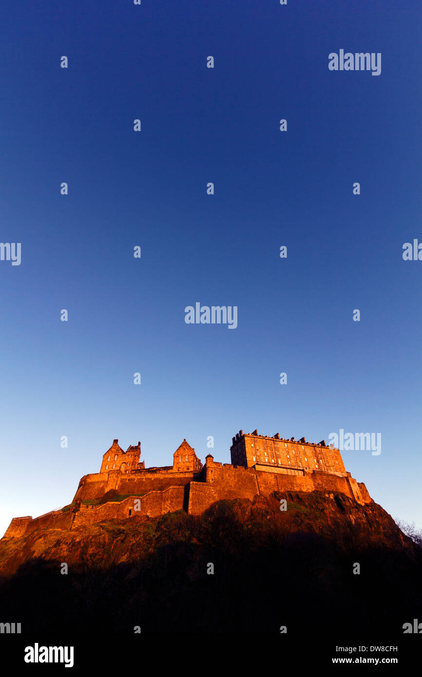 Edinburgh Castle With Warm Light And Blue Sky Stock Photo