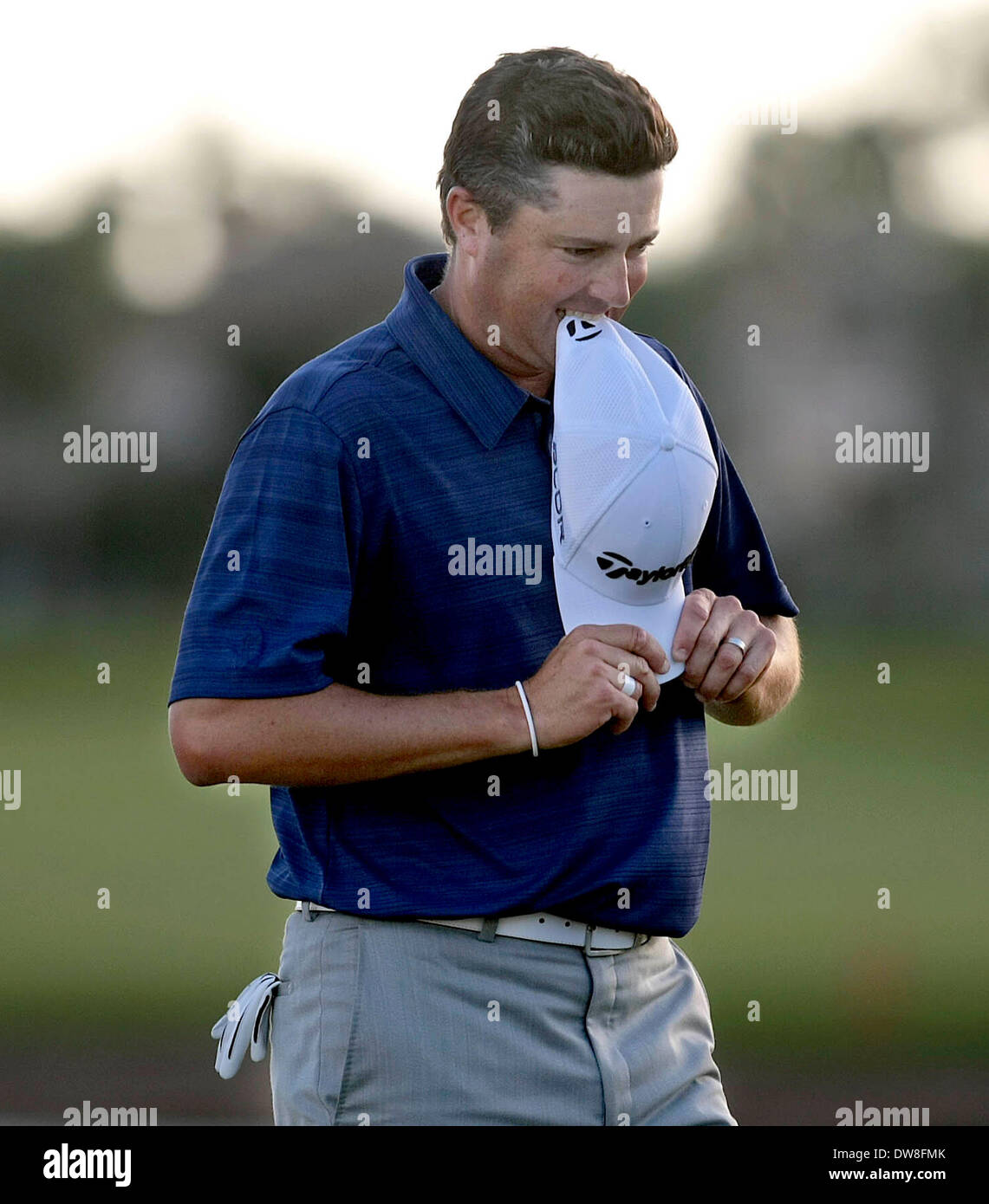 Palm Beach Gardens, Florida, USA. 2nd Mar, 2014. Ryan Palmer bites his cap after missing what would have been the winning putt at the 18th green during the final round of the 2014 Honda Classic Sunday, Mar 2, 2014 at PGA National in Palm Beach Gardens. Palmer went on to play in a four player playoff won by Russell Henley. © Bill Ingram/The Palm Beach Post/ZUMAPRESS.com/Alamy Live News Stock Photo