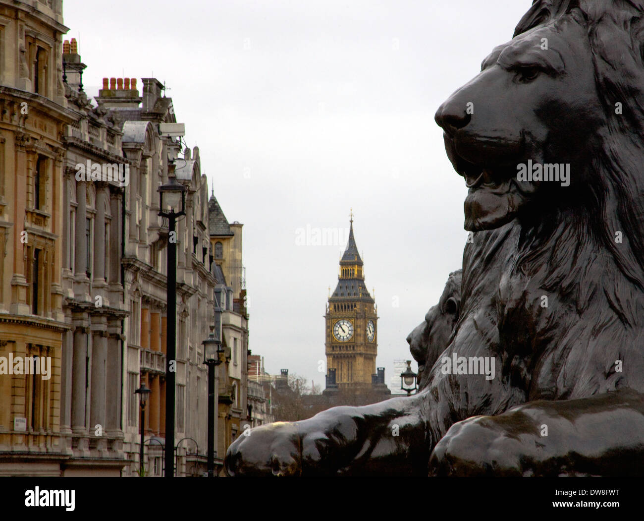 London's Trafalgar square Lions two statues with Big Ben Westminster clock tower in background Stock Photo