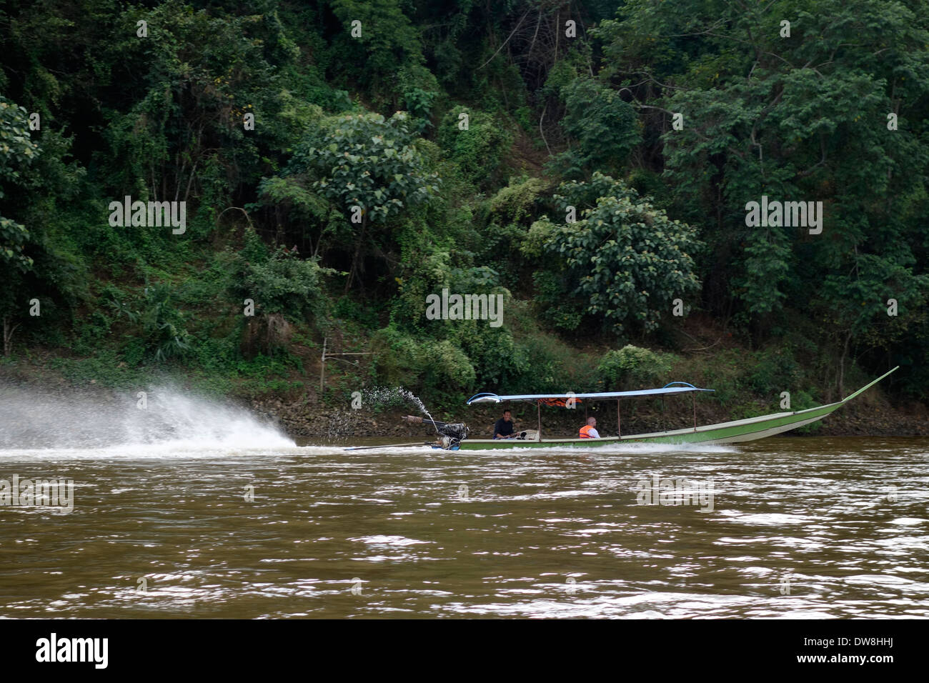 Long-tail boat on the Nam Kok River, Thailand. Stock Photo
