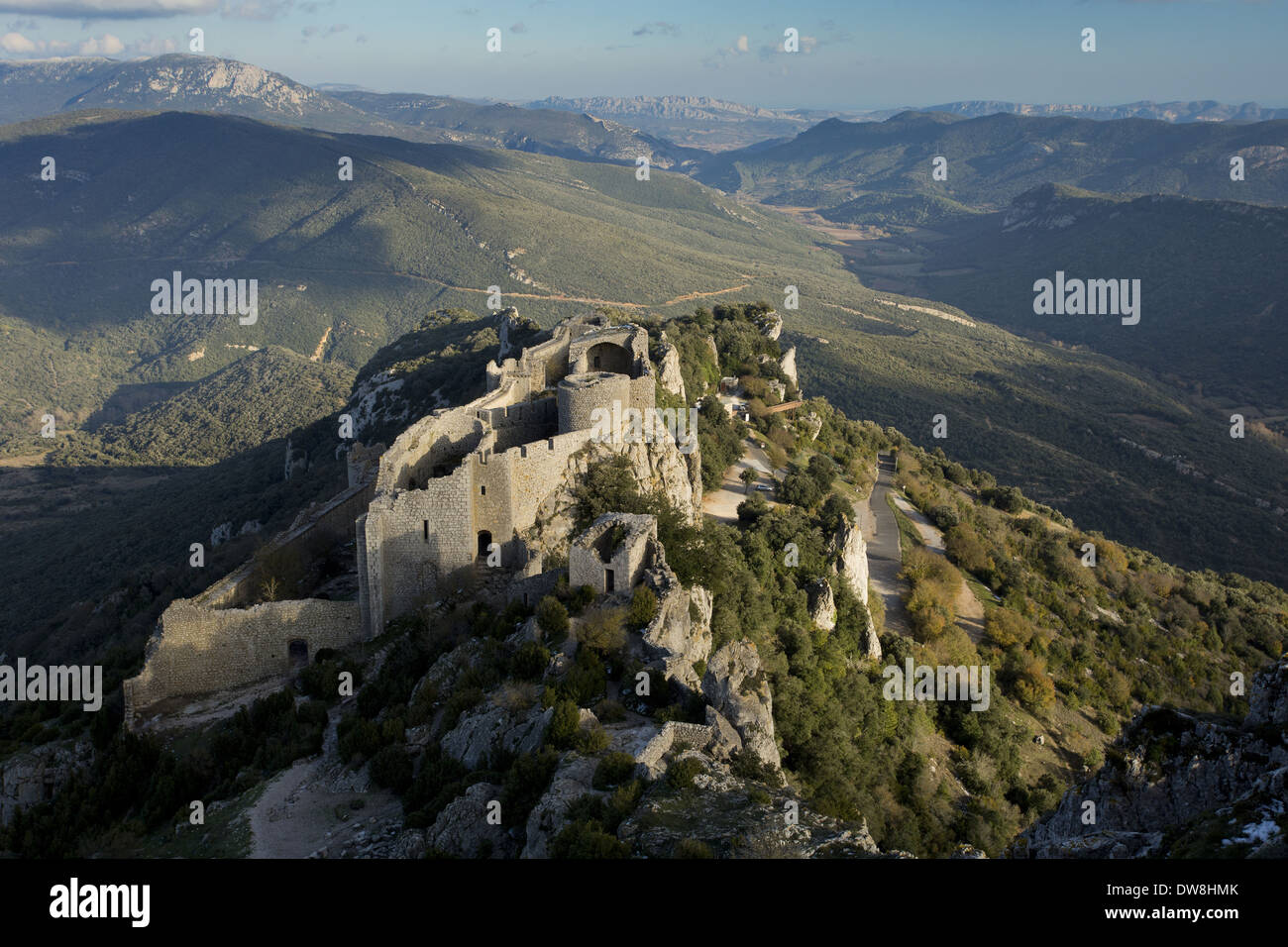 View of ruined 'Cathar Castle' fortress on limestone ridge Chateau de Peyrepertuse Duilhac-sous-Peyrepertuse Aude Stock Photo