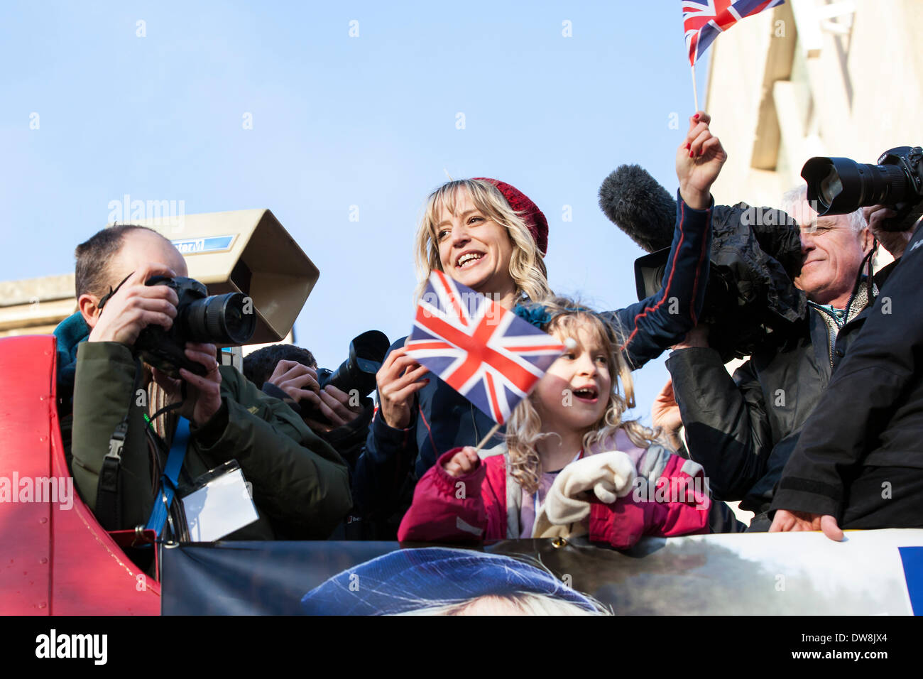 Bristol, UK. 3rd Mar, 2014. Snowboarder Jenny Jones toured through the streets of Bristol on an open top bus to celebrate her bronze medal win at the Sochi winter Olympics.  The bus went from her home area of Downend in South Gloucestershire to the Council Offices in Bristol city centre.  Afterwards she attended a reception in the council offices.  Supporters turned out along the route waving Union Jack flags in Bristol, March 3rd 2014. Credit:  Redorbital Photography/Alamy Live News Stock Photo