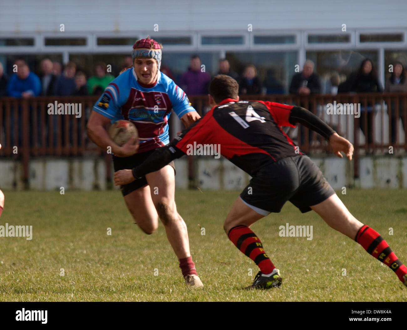 Amateur rugby player carrying the ball, Bude, Cornwall, UK Stock Photo