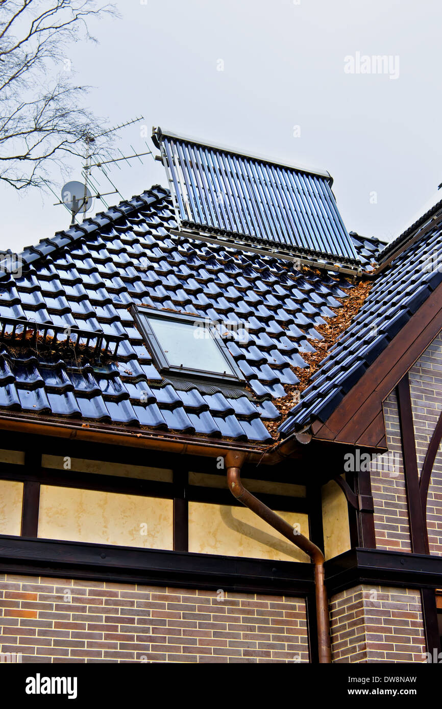 Solar collector on the roof of the new house Stock Photo - Alamy