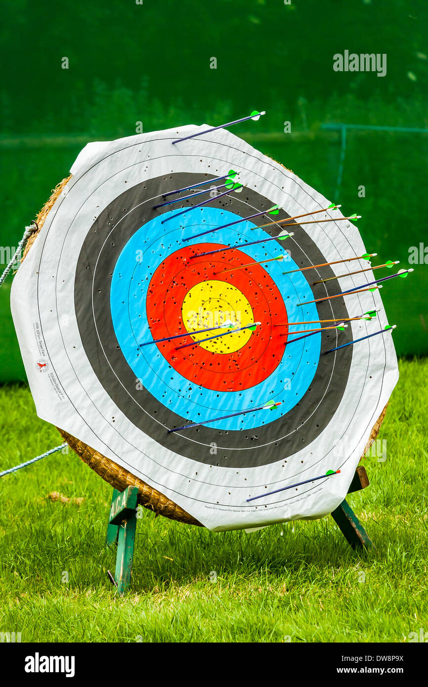 Bullseye Target with many arrows surrounding the bull yet none on the bullseye it's self conceptual idea for missing the target Stock Photo