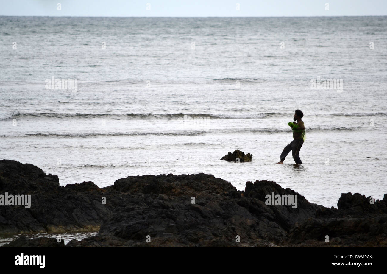 Kanak fisherman at work, Poindimie, New Caledonia, South Pacific Stock Photo