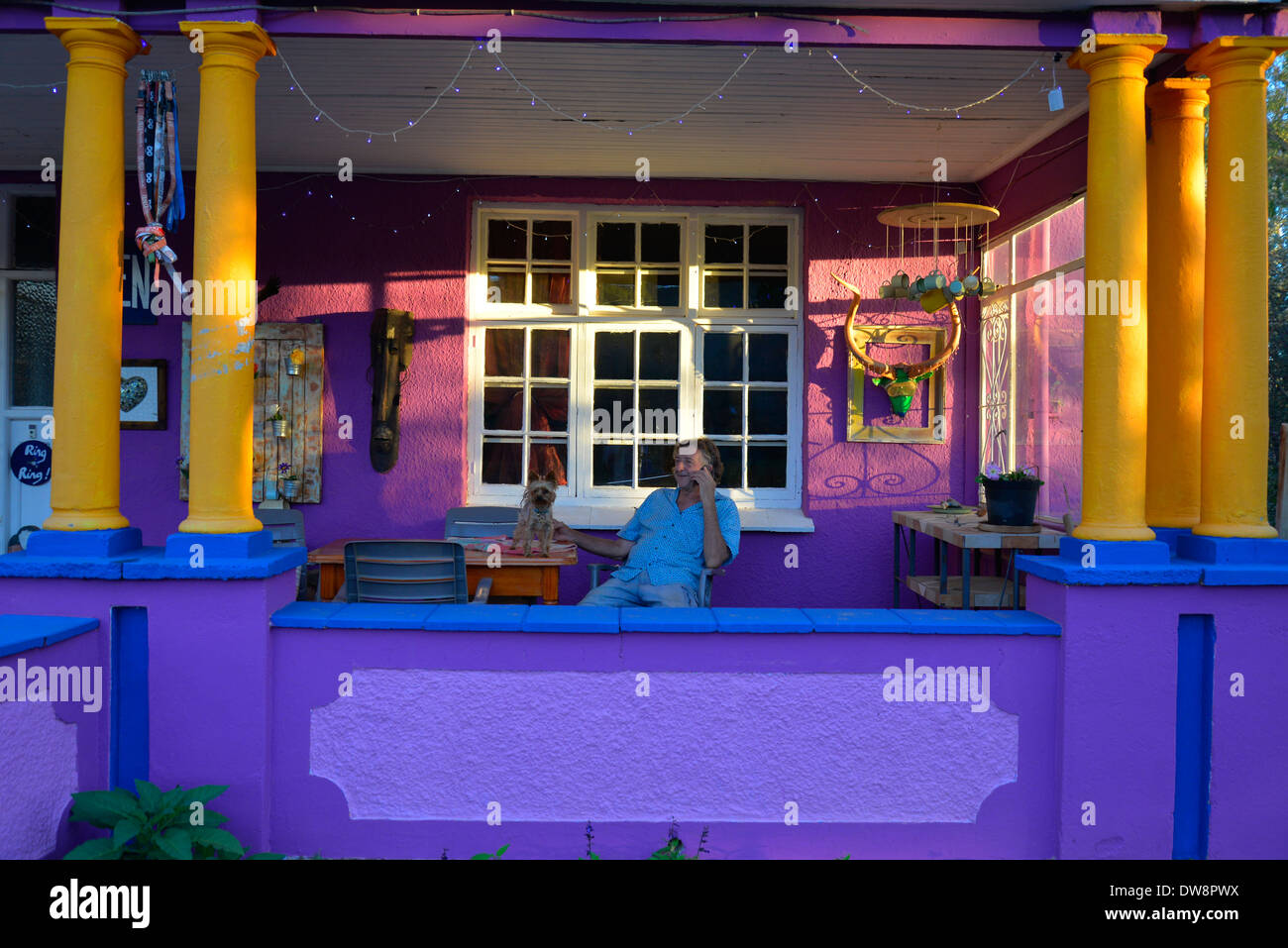 Brightly coloured houses in Smithfield, Free State, South Africa. Man
