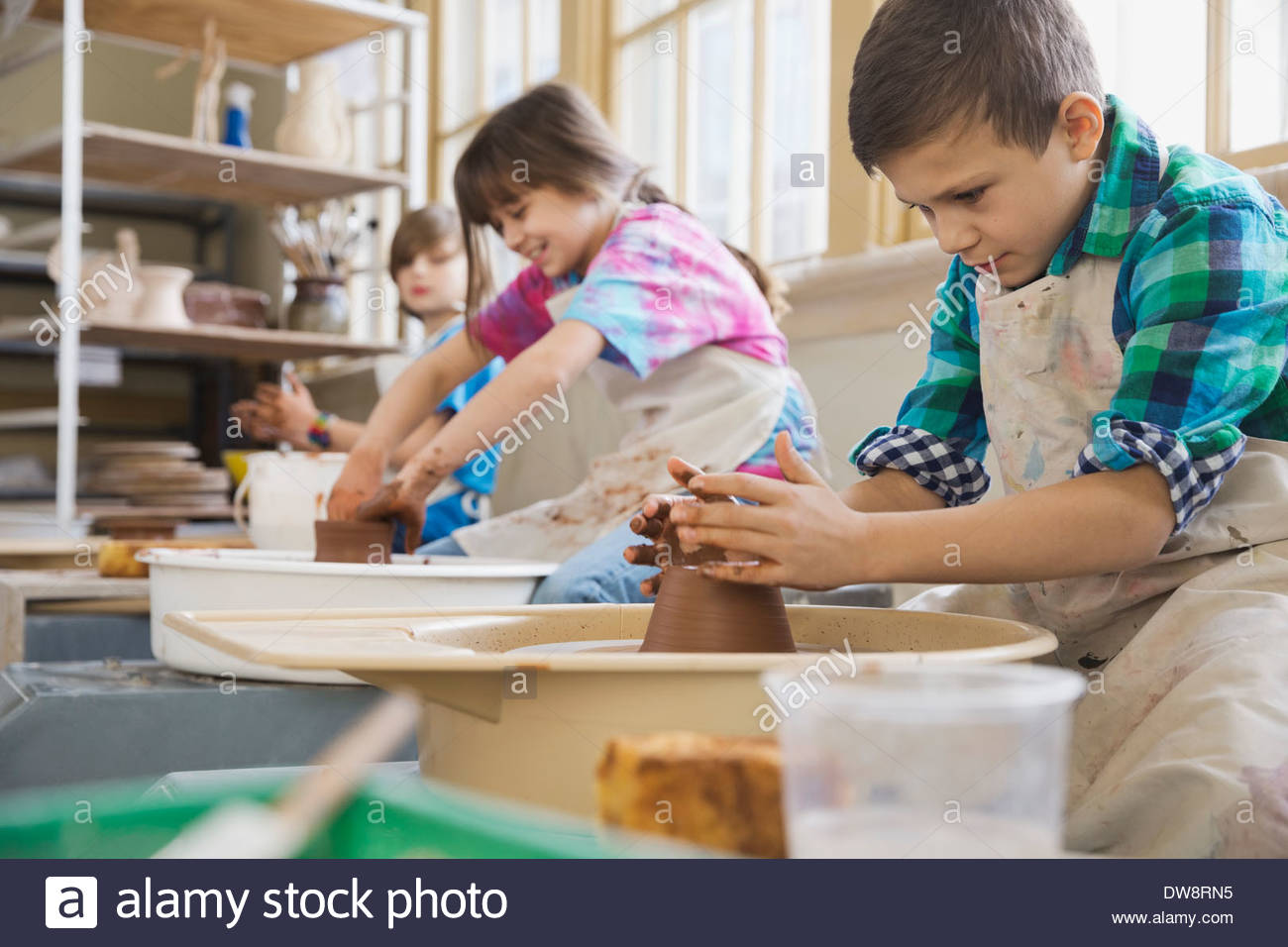 Kids in pottery class Stock Photo Alamy