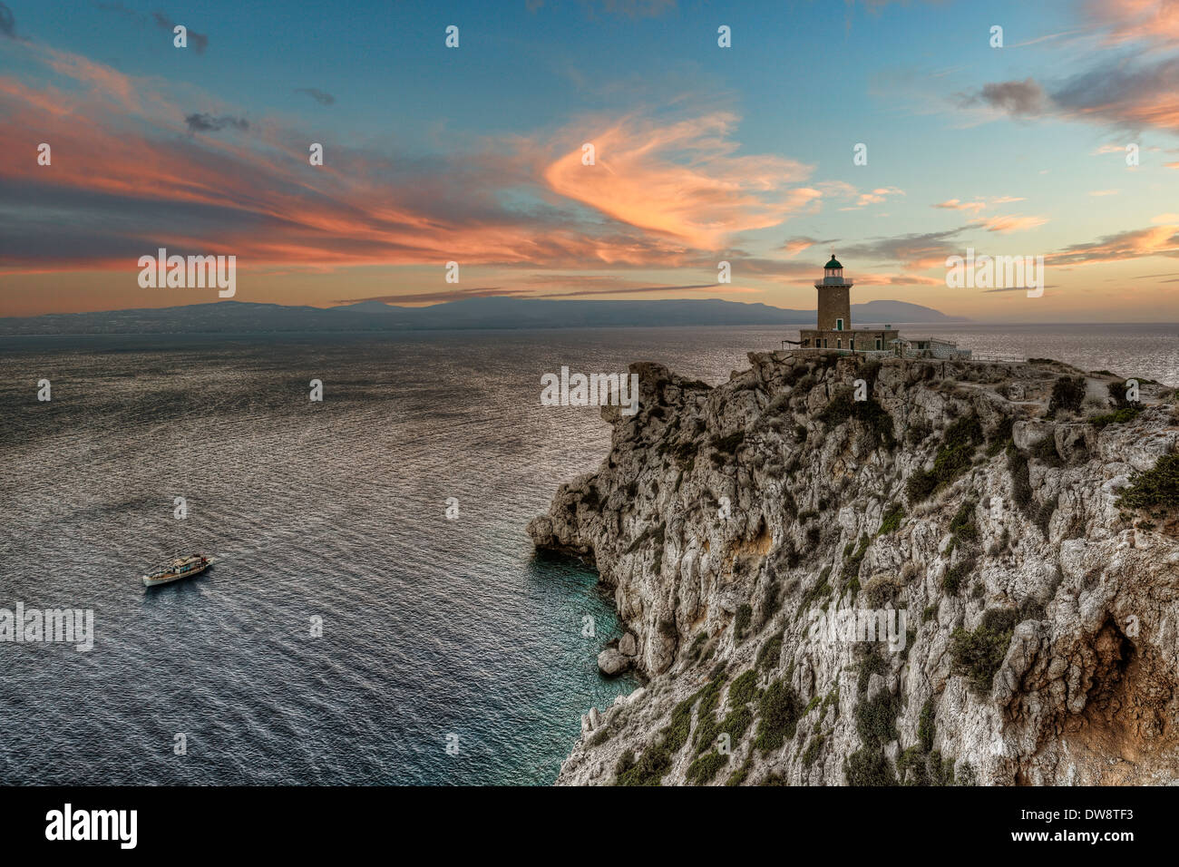 Sunset at Cape Melagavi Lighthouse in Corinthia, Greece Stock Photo