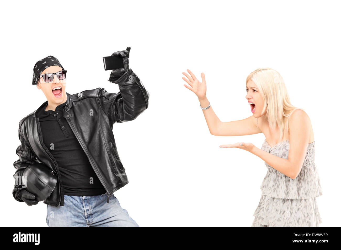 Mad woman yelling at her biker boyfriend Stock Photo