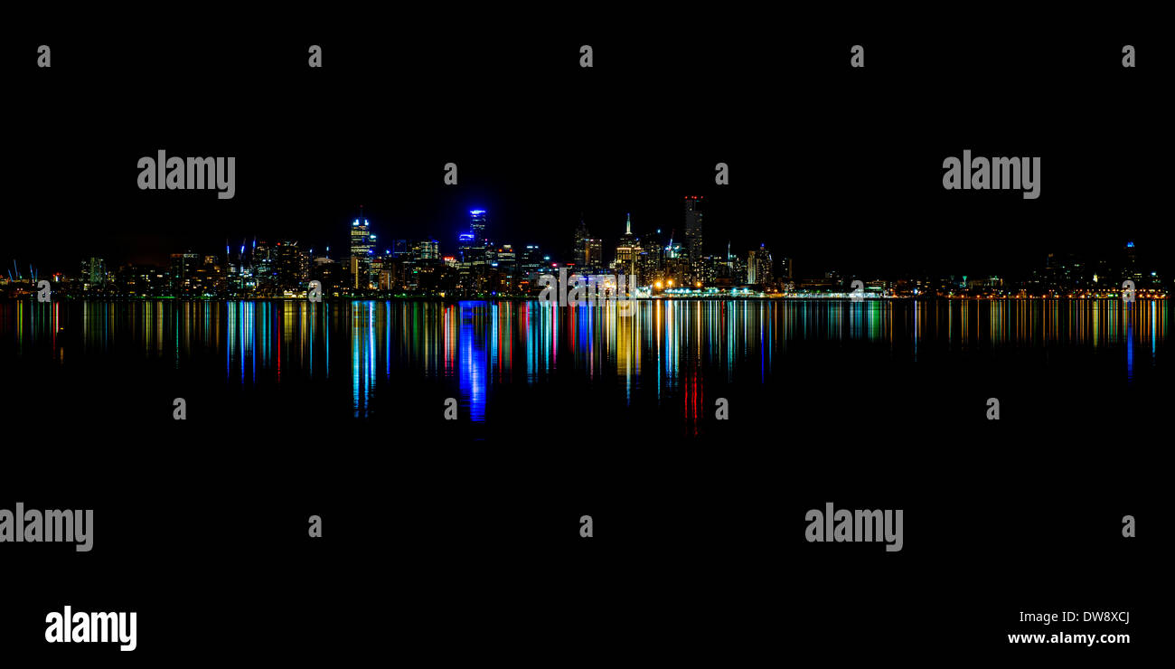 Melbourne skyline over Port Phillip Bay on a still night Stock Photo
