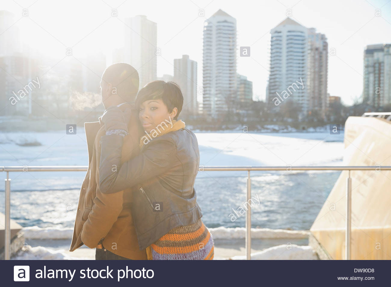 Affectionate couple against cityscape Stock Photo