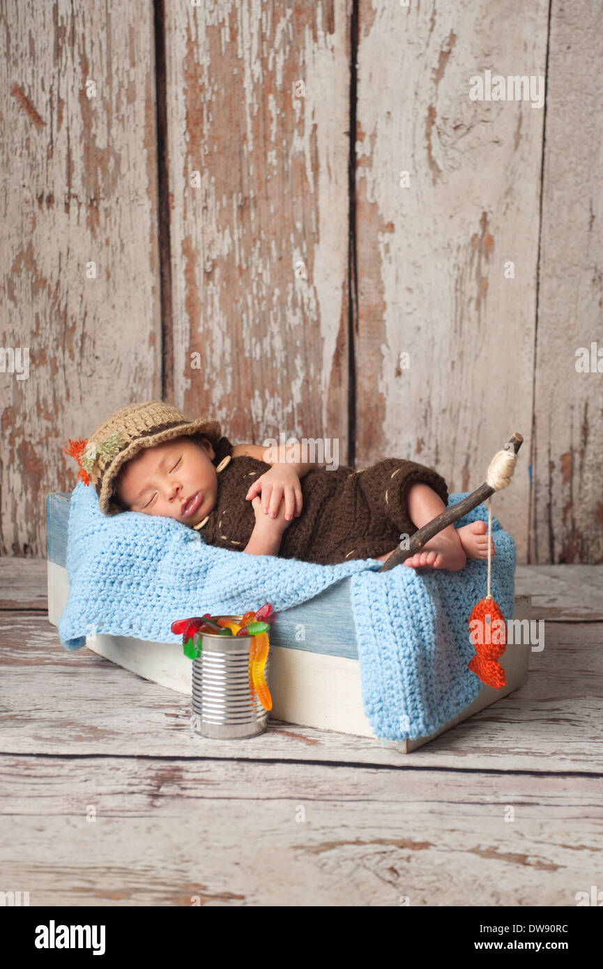 Newborn baby boy wearing a fisherman costume Stock Photo - Alamy