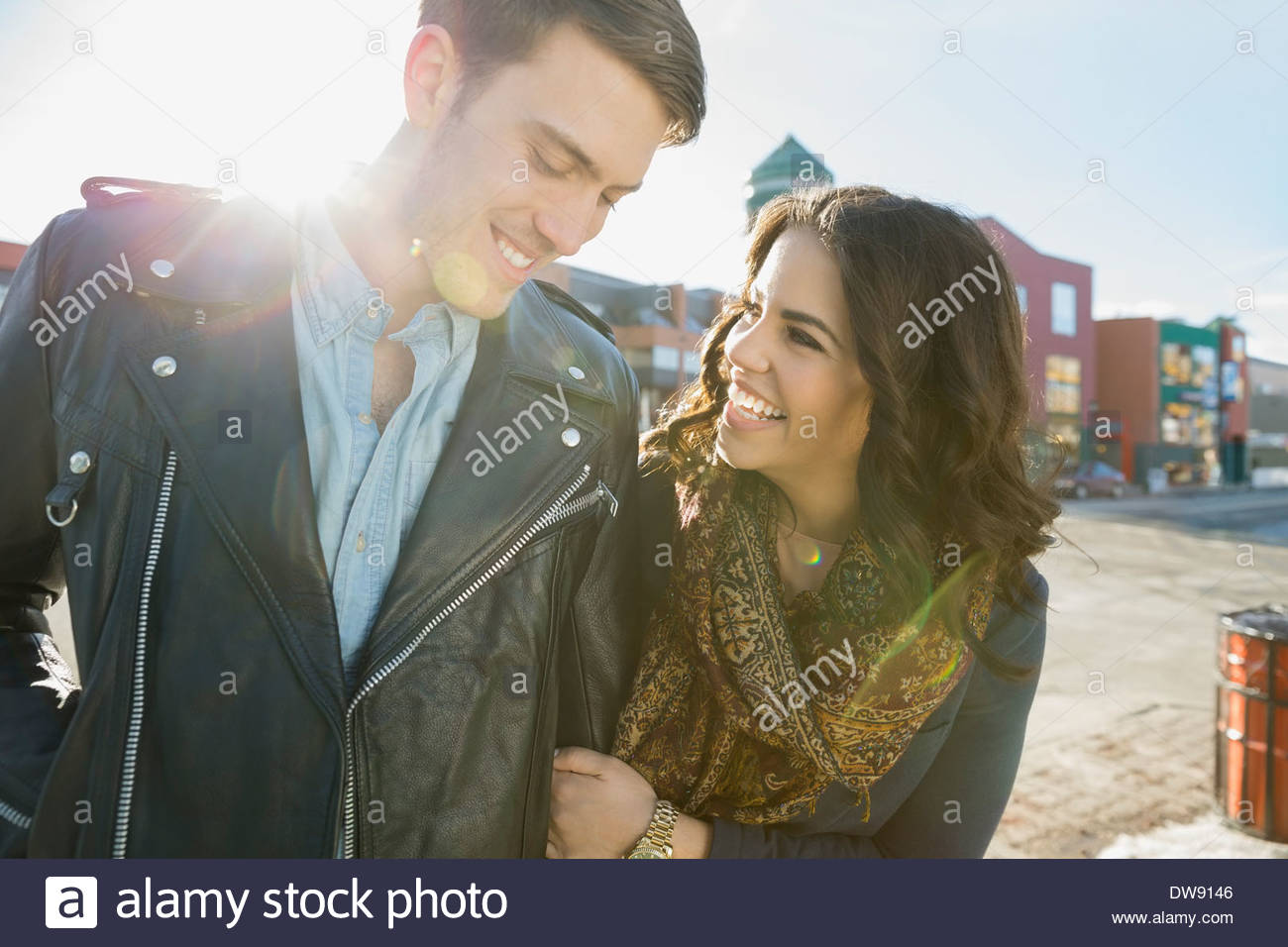 Loving couple walking on city street Stock Photo