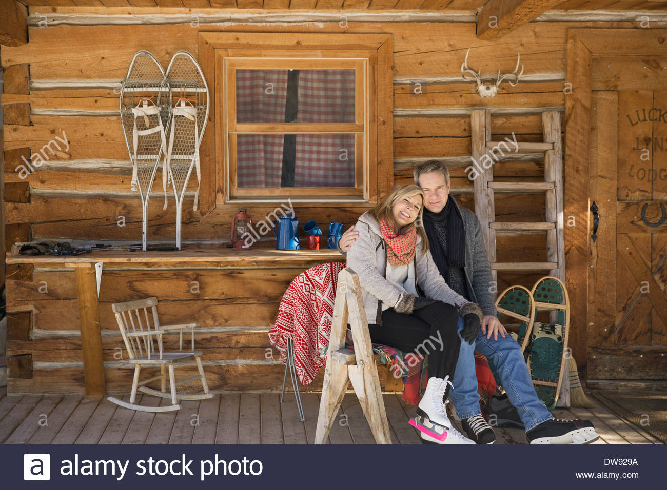Couple sitting on cabin porch hi-res stock photography and images - Alamy