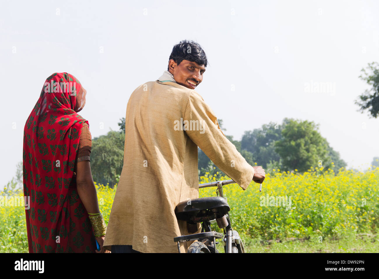 Indian farmer standing with wife in farm Stock Photo - Alamy