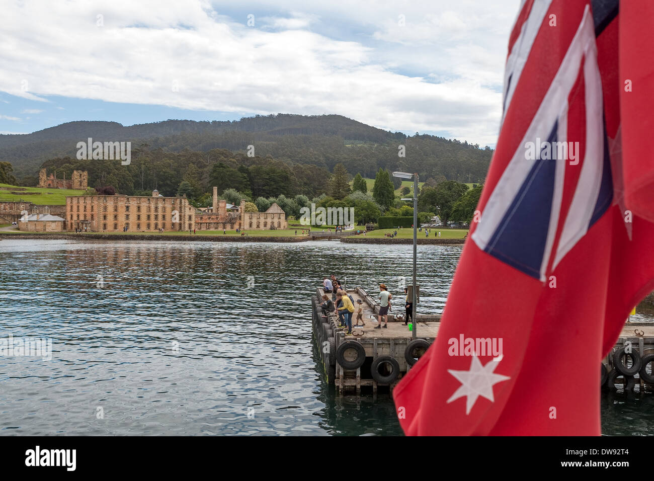 The Penitentiary, old flour mill, Port Arthur, Tasmania, Australia from rear of boat flying Red Ensign Stock Photo