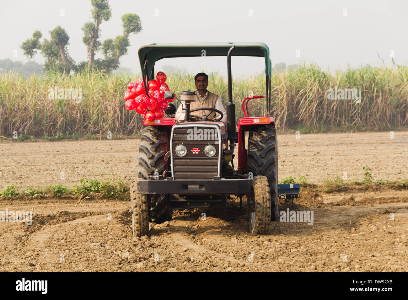 Indian farmer ploughing field tractor hi-res stock photography and ...