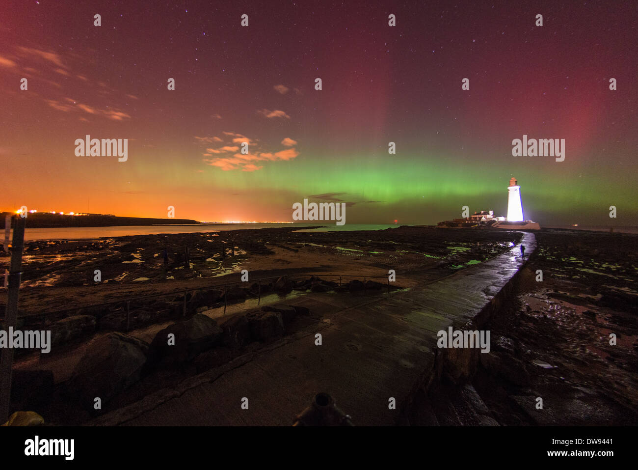 The Aurora borealis AKA The Northern Lights, dance over St. Mary's Lighthouse in Whitley Bay. Stock Photo