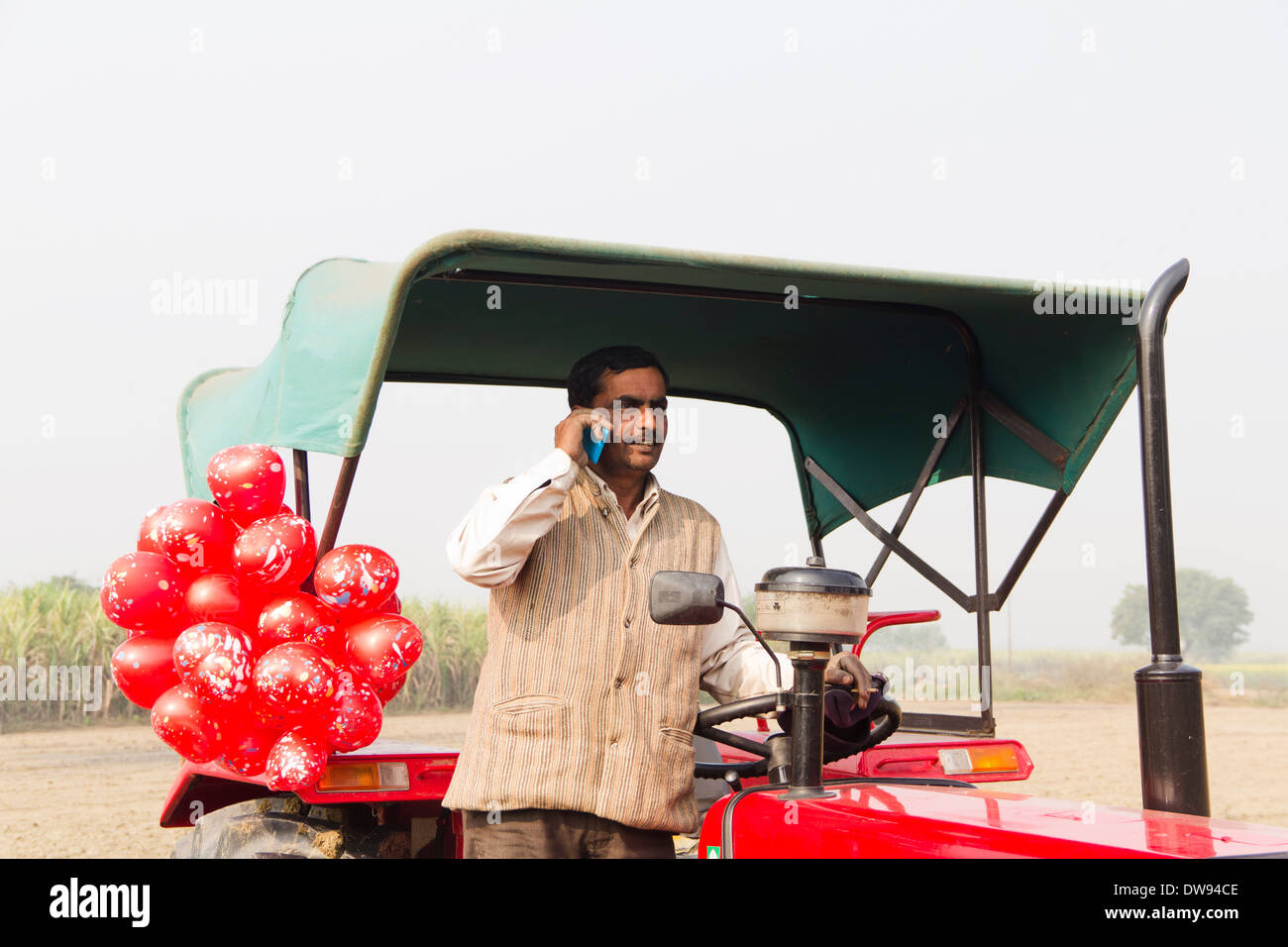 1 Indian farmer Standing In Front Of Tractor and talking Stock Photo ...