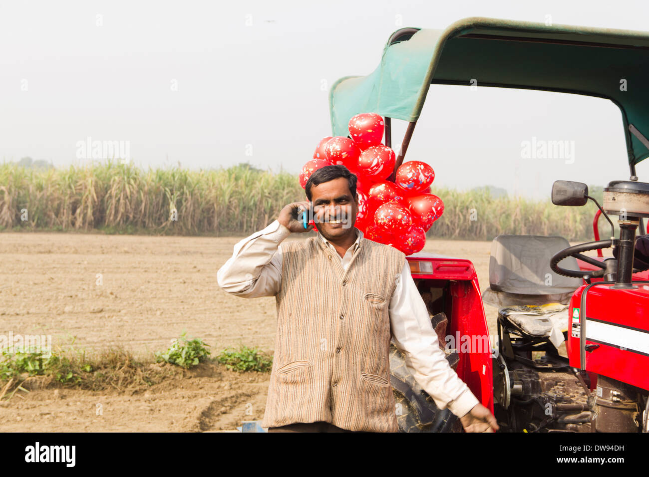 1 Indian farmer Standing In Front Of Tractor and talking Stock Photo ...