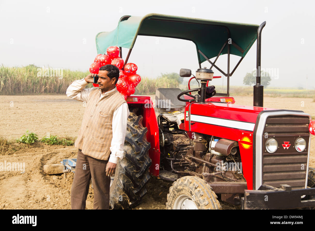 1 Indian farmer Standing In Front Of Tractor and talking Stock Photo ...