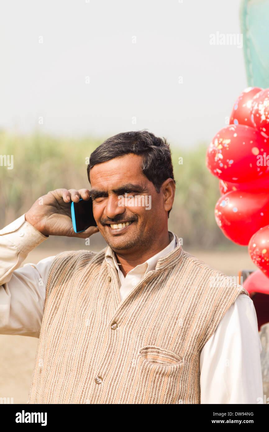 1 Indian farmer Standing In Front Of Tractor and talking Stock Photo ...