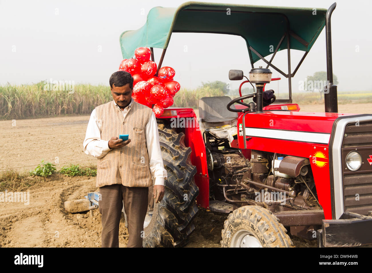 1 Indian farmer Standing In Front Of Tractor Stock Photo - Alamy
