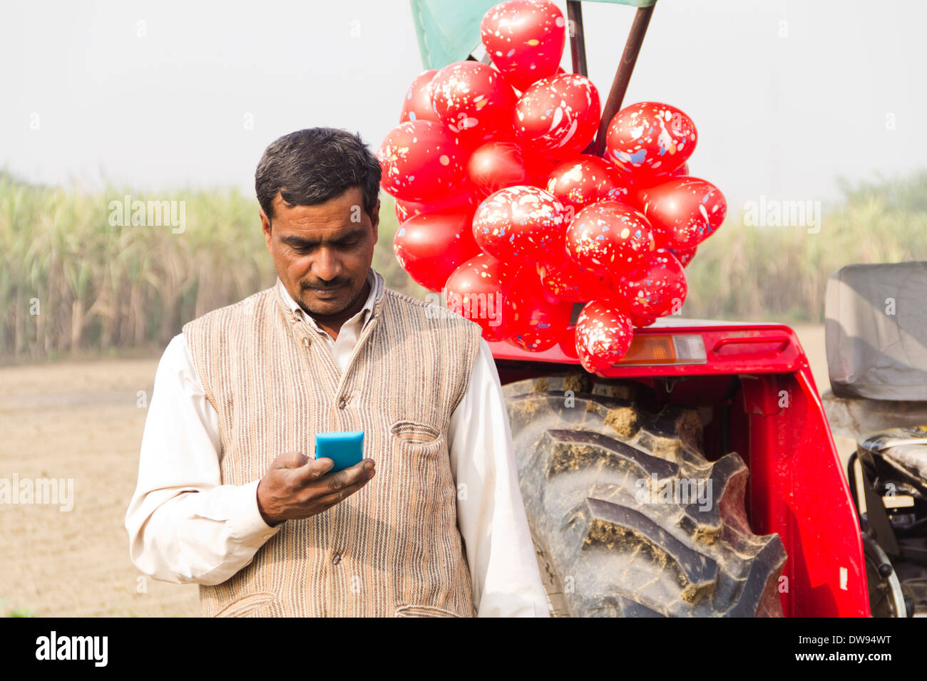 1 Indian farmer Standing In Front Of Tractor Stock Photo - Alamy