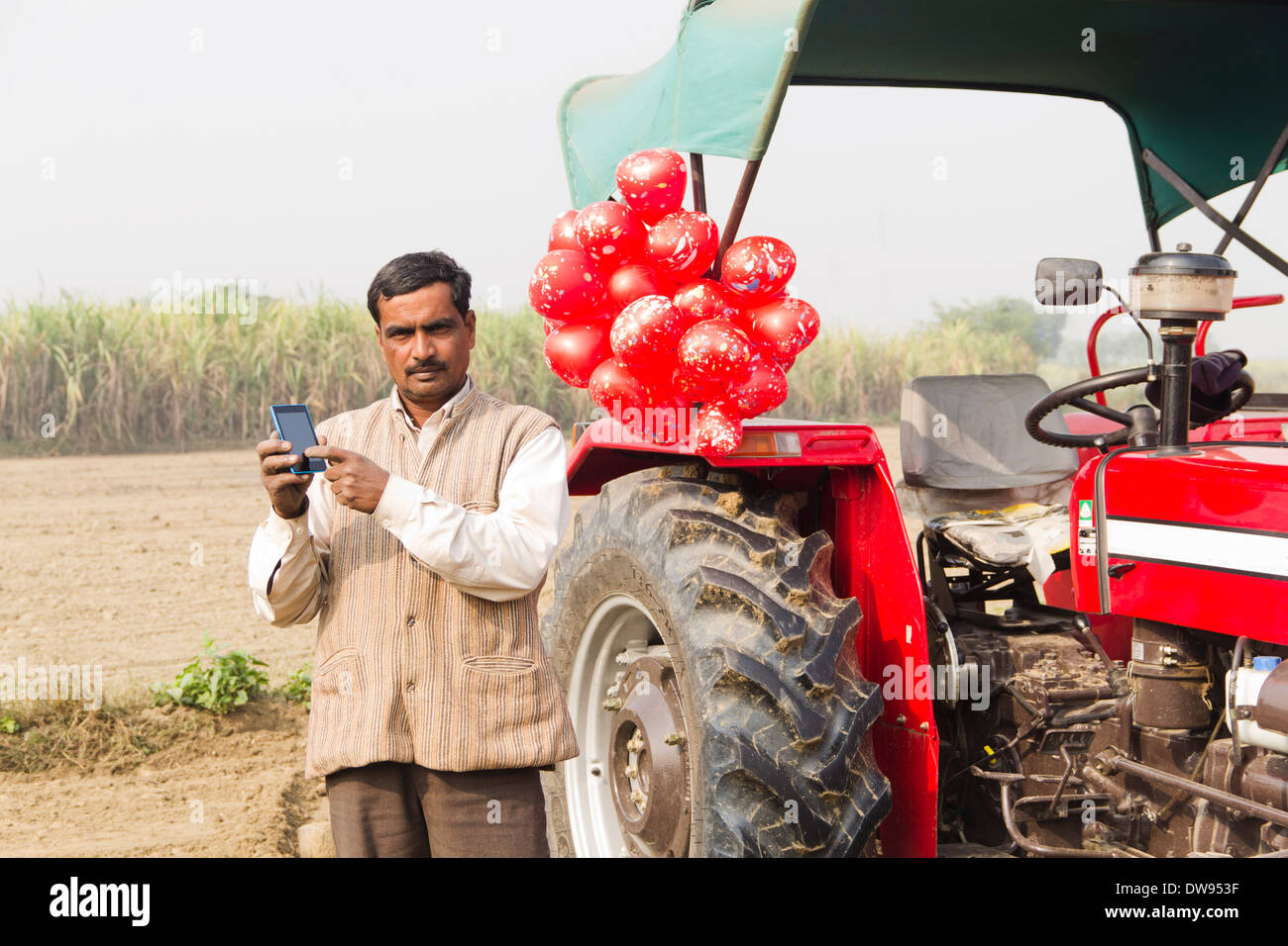 1 Indian farmer Standing In Front Of Tractor Stock Photo - Alamy