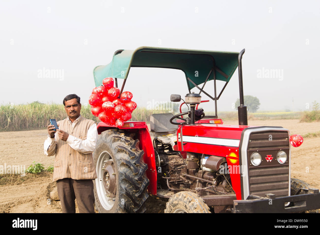 1 Indian farmer Standing In Front Of Tractor Stock Photo - Alamy