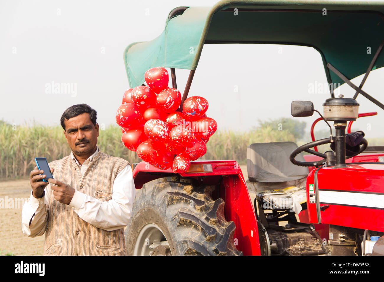 1 Indian farmer Standing In Front Of Tractor Stock Photo - Alamy