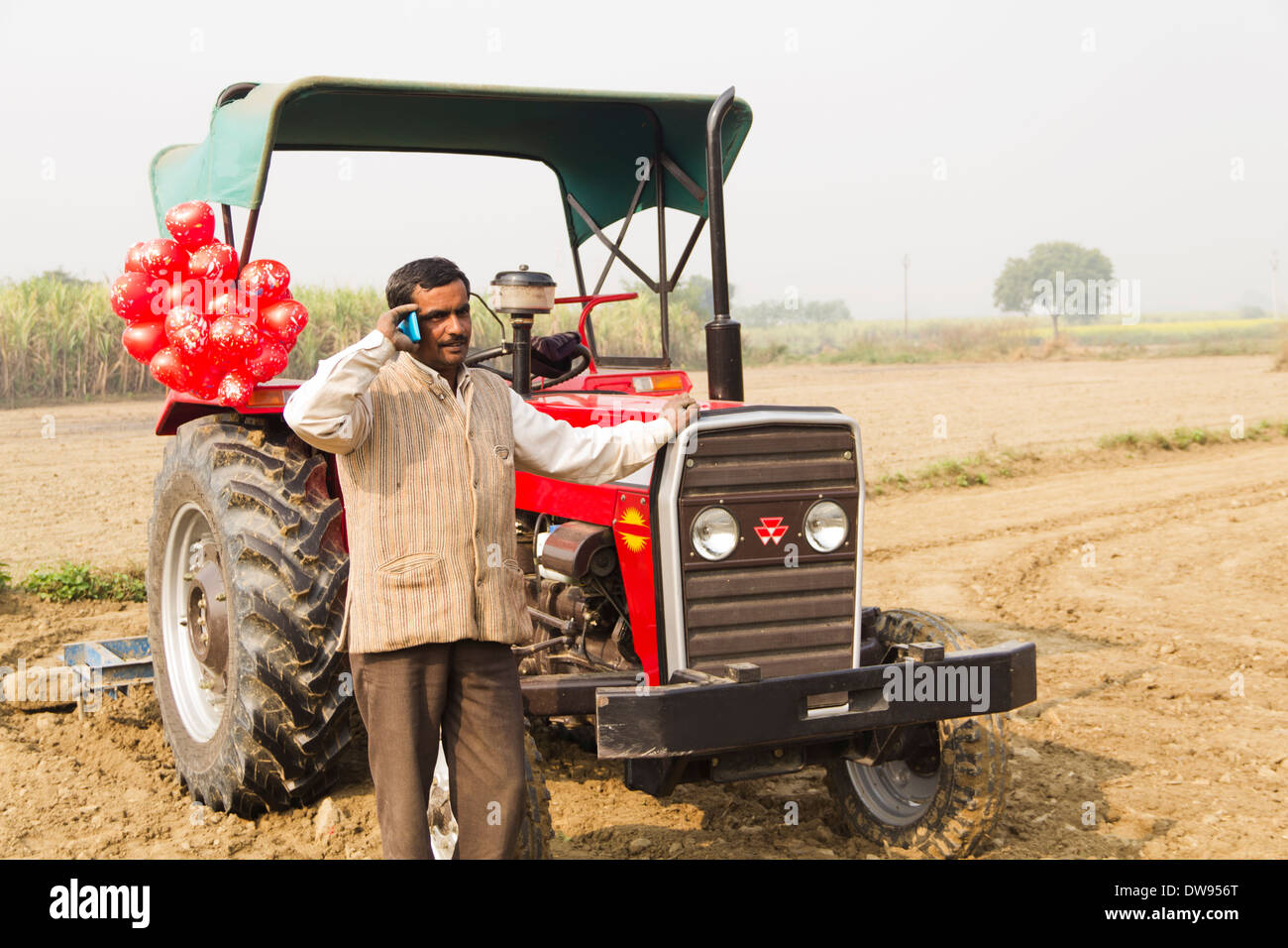 1 Indian farmer Standing In Front Of Tractor Stock Photo - Alamy