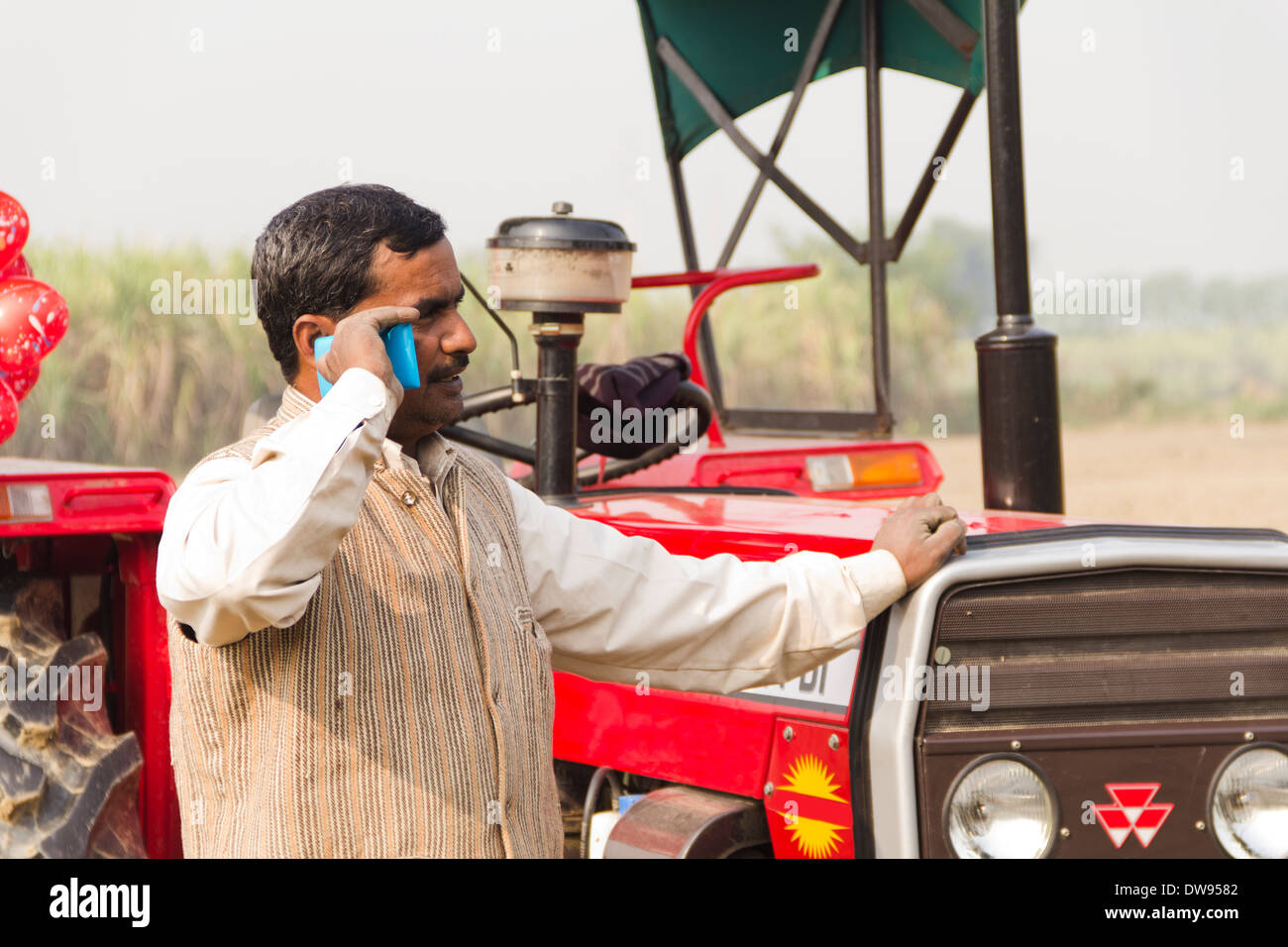 1 Indian farmer Standing In Front Of Tractor Stock Photo - Alamy