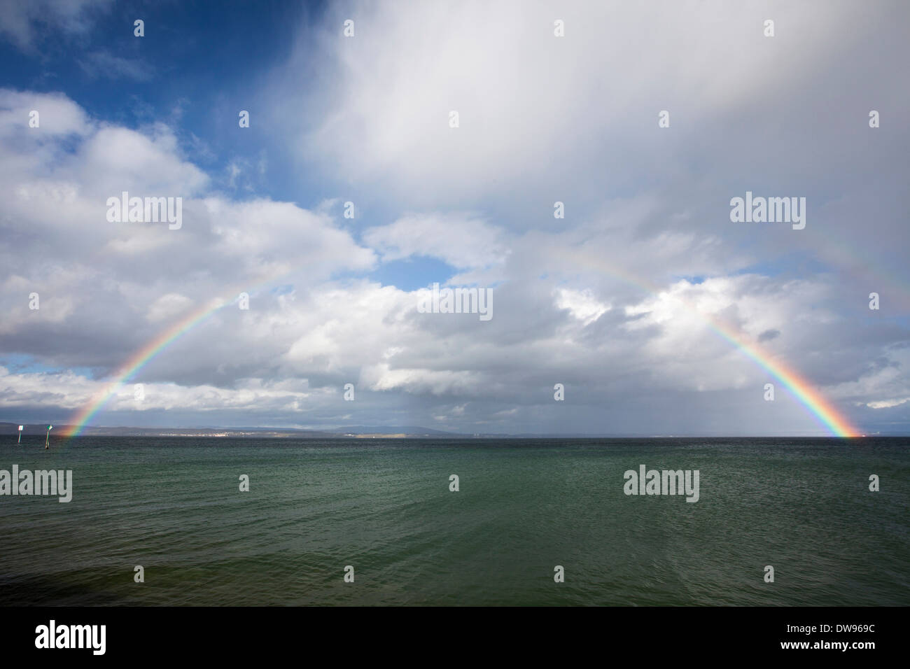 Full rainbow over Lake Constance, near Güttingen, Canton of Thurgau, Switzerland Stock Photo