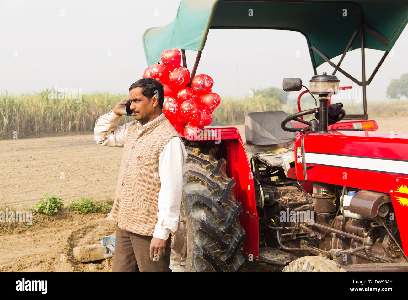 1 Indian farmer Standing In Front Of Tractor and talking Stock Photo ...