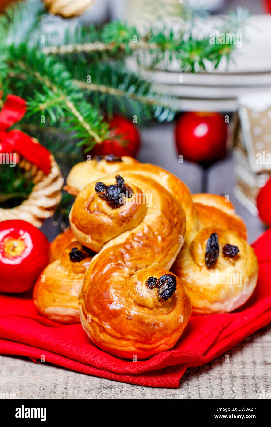 Traditional swedish buns in christmas setting. A saffron bun, lussebulle or lussekatt Stock