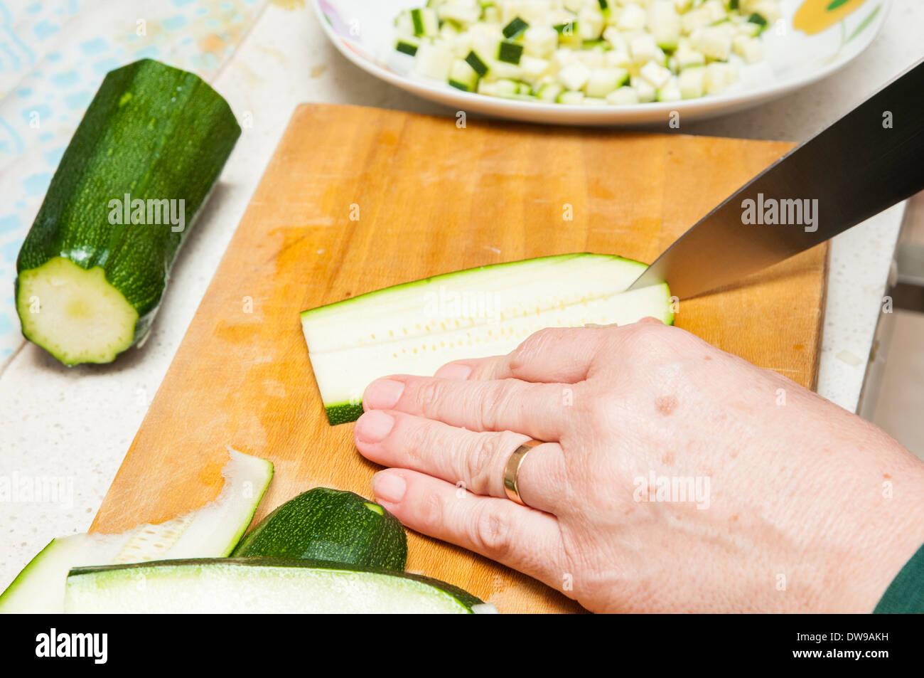 cook cucumber cut into small pieces Stock Photo