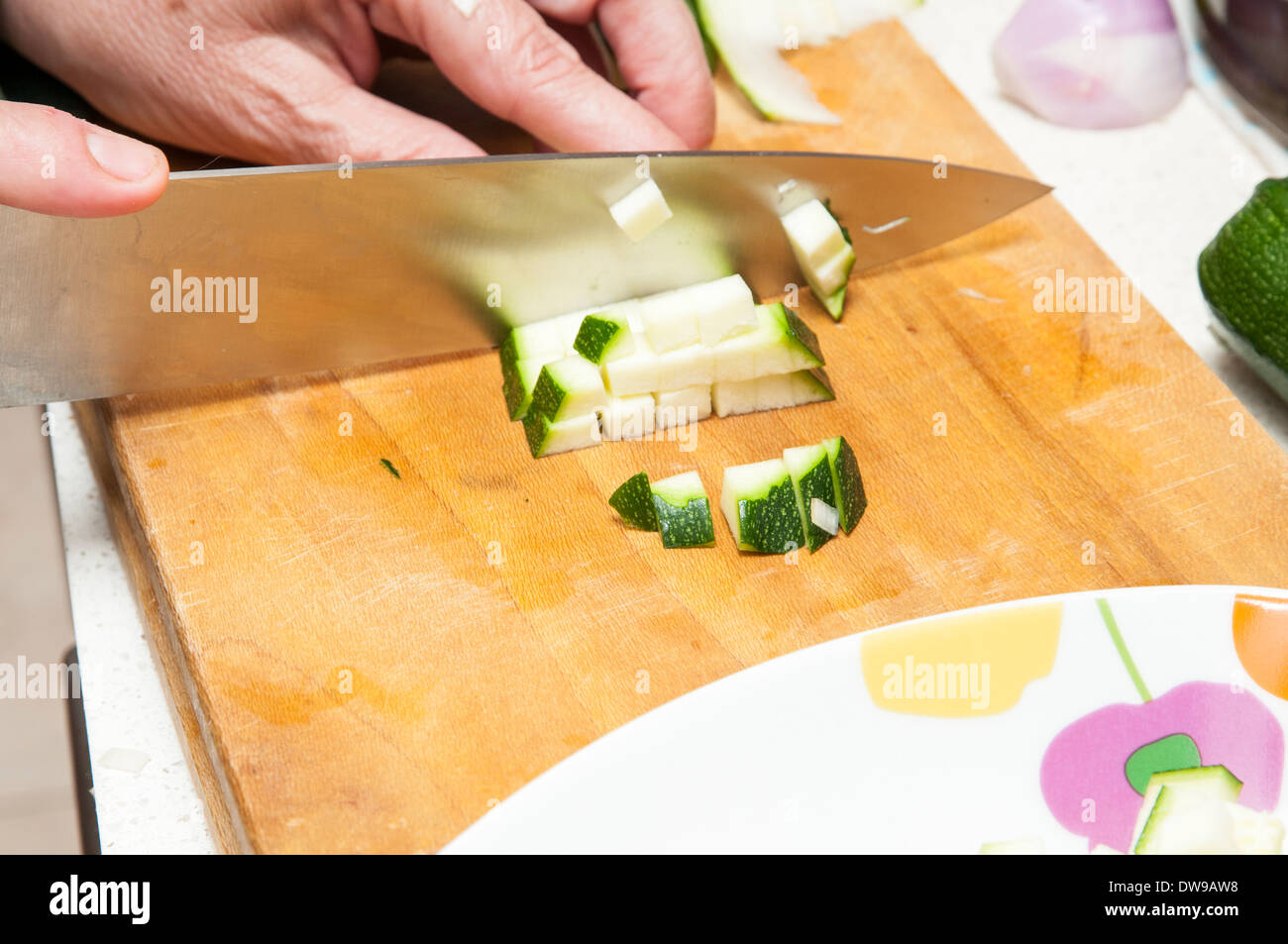 cook cucumber cut into small pieces Stock Photo