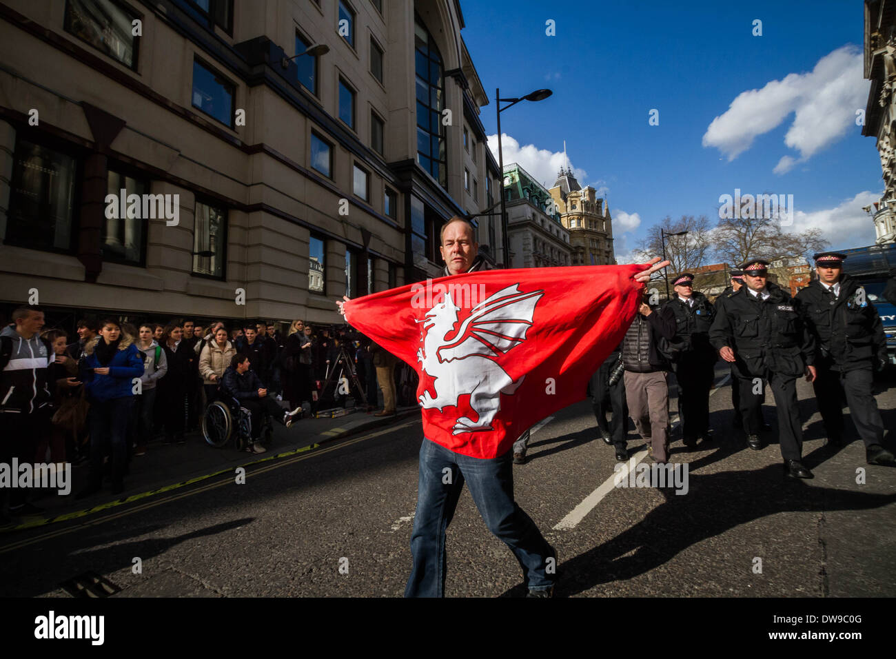 A far right protester with St.George dragon flag awaiting sentencing of Lee Rigby killers outside Old Bailey in London. Stock Photo